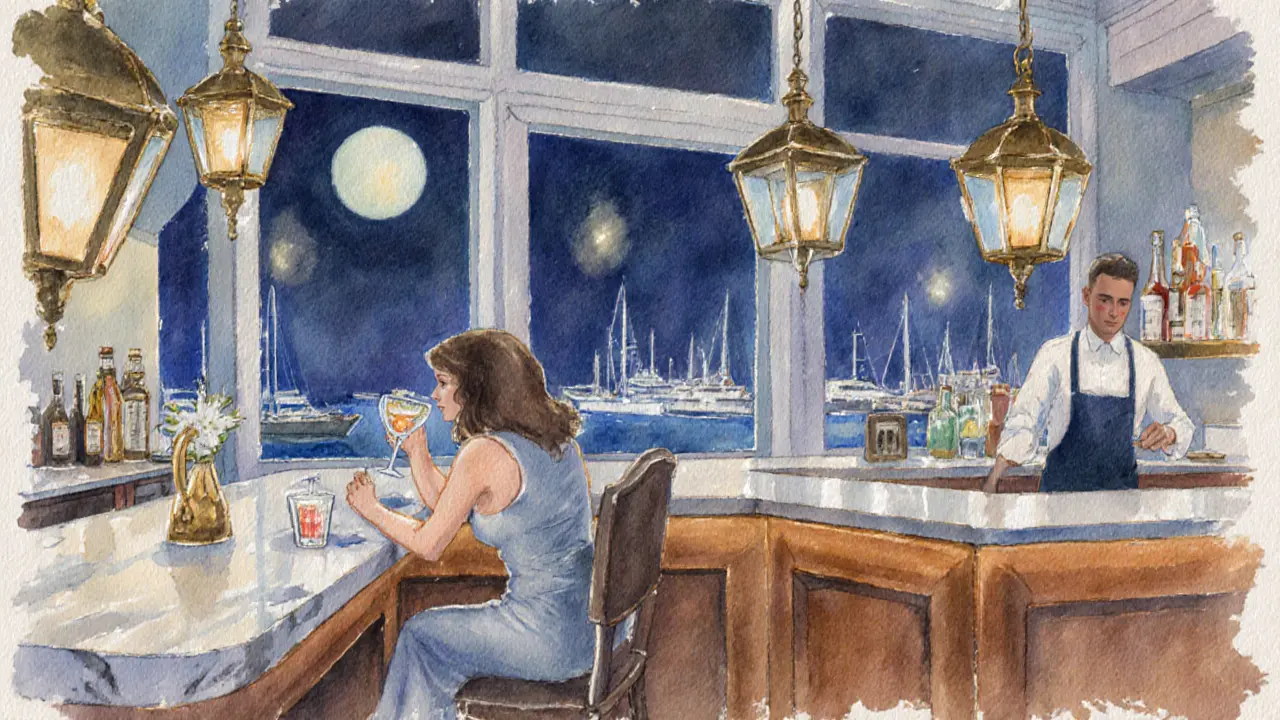 Cozy seaside bar at night with patrons enjoying cocktails beside a window.