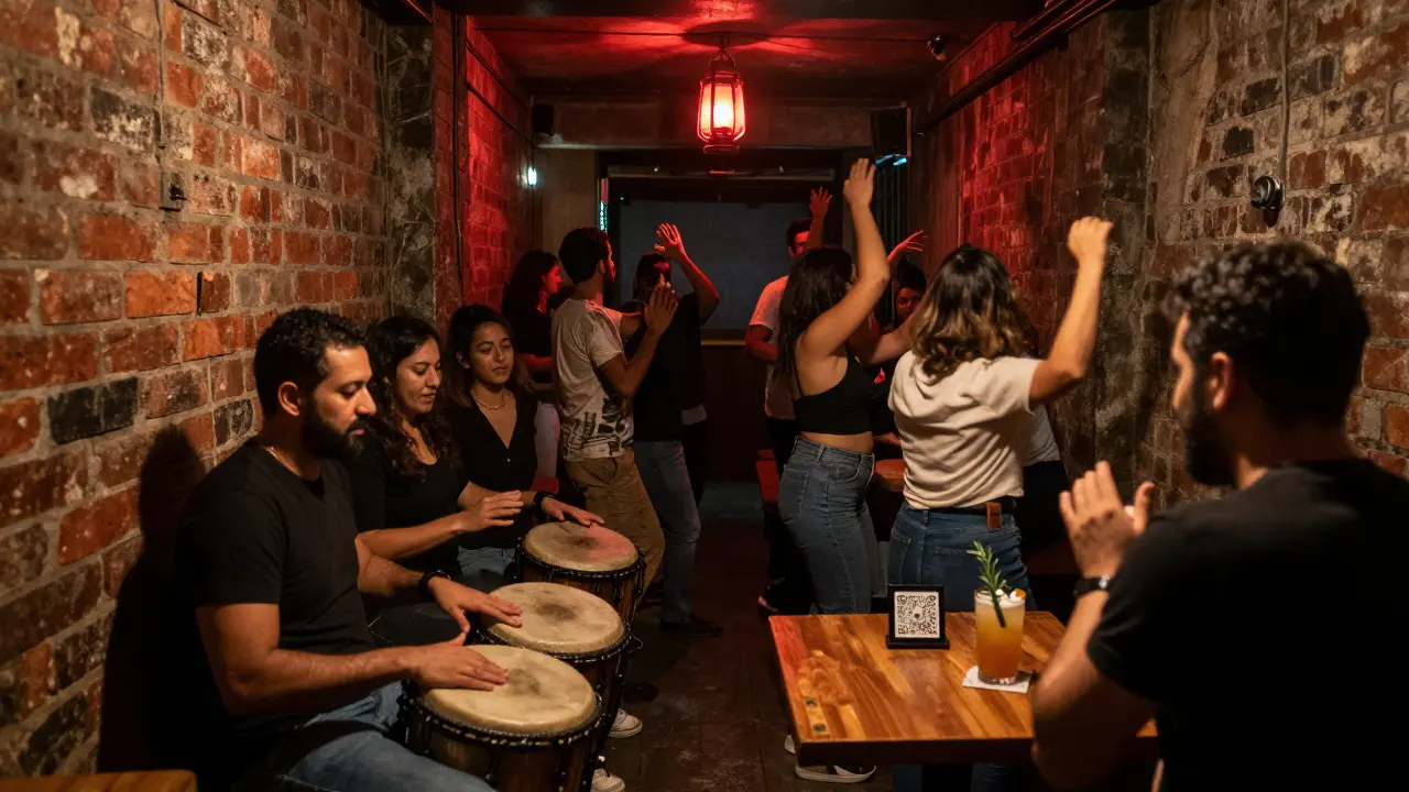 Dim underground venue with brick walls, red lantern, and people dancing to live percussion.
